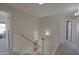 Open hallway featuring carpet flooring, white walls, and decorative sconces throughout the upper level at 42812 W Venture Rd, Maricopa, AZ 85138