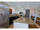 Updated kitchen with granite countertops, stainless steel appliances, and white cabinetry at 42812 W Venture Rd, Maricopa, AZ 85138