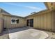 This private back patio features concrete, gravel landscaping, and mature trees at 4752 N 20Th Ave, Phoenix, AZ 85015