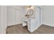 Bathroom vanity with a white stool and closet at 4752 N 20Th Ave, Phoenix, AZ 85015