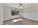 Bright bedroom boasts wainscoting, wood flooring, and a large window for natural light at 4752 N 20Th Ave, Phoenix, AZ 85015