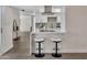 Bright, remodeled kitchen with a breakfast bar and white cabinets at 4752 N 20Th Ave, Phoenix, AZ 85015