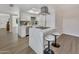 Bright, remodeled kitchen with a breakfast bar, new stainless steel appliances, and a modern range hood at 4752 N 20Th Ave, Phoenix, AZ 85015