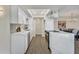 Modern kitchen with sleek white cabinets, stainless steel appliances, and updated countertops at 4752 N 20Th Ave, Phoenix, AZ 85015