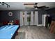 Finished basement featuring a billiard table and sliding glass doors with access to outdoors at 4755 E Gary St, Mesa, AZ 85205