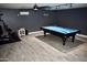 Large basement featuring a billiard table, exercise equipment and neutral walls with recessed lighting at 4755 E Gary St, Mesa, AZ 85205