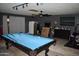 Basement with billiard table, storage, and drop ceiling at 4755 E Gary St, Mesa, AZ 85205