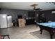Basement featuring a billiard table, an arcade machine, and a refrigerator at 4755 E Gary St, Mesa, AZ 85205