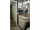 Modern bathroom vanity features a granite countertop, white cabinets, and updated fixtures at 4755 E Gary St, Mesa, AZ 85205