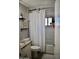 Clean bathroom featuring a shower and tub combination with bright white tile at 4755 E Gary St, Mesa, AZ 85205