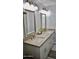 Bright bathroom featuring double sinks, granite countertops, and modern fixtures at 4755 E Gary St, Mesa, AZ 85205