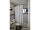 Clean bathroom featuring a shower and tub combination with bright white tile at 4755 E Gary St, Mesa, AZ 85205