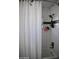 Bathroom with subway tile walls, shower head, and white textured curtain at 4755 E Gary St, Mesa, AZ 85205