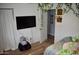 Comfortable bedroom with a large TV, walk-in closet, and cozy bed at 4755 E Gary St, Mesa, AZ 85205