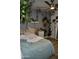 Bedroom featuring leafy vines, neutral paint, light wood flooring, and plenty of natural light at 4755 E Gary St, Mesa, AZ 85205