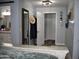 Bedroom with en-suite bathroom, large mirror and plenty of closet space at 4755 E Gary St, Mesa, AZ 85205