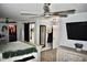 Bright bedroom boasting a large bed, a ceiling fan, and closet space at 4755 E Gary St, Mesa, AZ 85205