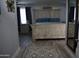 Bedroom featuring a large bed, accent rug, light wood flooring, and rustic white furniture at 4755 E Gary St, Mesa, AZ 85205