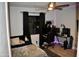 Modern bedroom with accent lighting, dark curtains, and desk setup at 4755 E Gary St, Mesa, AZ 85205