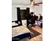 Comfortable bedroom with dark curtains and a ceiling fan, featuring a workspace at 4755 E Gary St, Mesa, AZ 85205