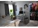 Bedroom with a neutral color palette, work space, walk-in closet, and wood-look flooring at 4755 E Gary St, Mesa, AZ 85205