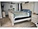 Bright bedroom with rustic white wood furnishings, a ceiling fan, and neutral paint at 4755 E Gary St, Mesa, AZ 85205