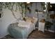 A cozy bedroom with natural light, accented by wall vines and plants at 4755 E Gary St, Mesa, AZ 85205
