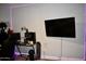 Gaming room with desk, PC, TV, skateboard, and purple LED lighting at 4755 E Gary St, Mesa, AZ 85205