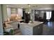A well-equipped kitchen with stainless steel appliances, gray island and plenty of counter space at 4755 E Gary St, Mesa, AZ 85205