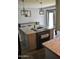 Kitchen island boasts a cooktop, granite counters, and stylish pendant lighting at 4755 E Gary St, Mesa, AZ 85205