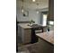 A kitchen with a large island, granite countertops, and stylish pendant lighting at 4755 E Gary St, Mesa, AZ 85205