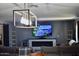 Spacious living room features a modern fireplace, large sectional sofa, and stylish lighting fixture at 4755 E Gary St, Mesa, AZ 85205