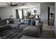 Spacious living room with plank floors, comfortable couch and open dining area at 4755 E Gary St, Mesa, AZ 85205