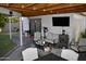 Cozy covered patio with comfortable seating, a TV, and a view of the backyard, perfect for relaxing at 4755 E Gary St, Mesa, AZ 85205