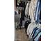 Functional walk-in closet with ample hanging space and wood-look flooring for organized storage at 4755 E Gary St, Mesa, AZ 85205