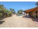 Lush backyard with pool, covered patio, and mature trees, perfect for outdoor living and entertaining at 4854 E Blanche Dr, Scottsdale, AZ 85254