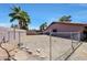 View of the backyard with chain link fence and palm trees, ideal for outdoor activities at 4854 E Blanche Dr, Scottsdale, AZ 85254