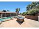 Backyard featuring a fire pit area and fenced pool, perfect for entertaining and outdoor gatherings at 4854 E Blanche Dr, Scottsdale, AZ 85254