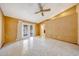 Bedroom features tile floors, ceiling fan, and glass doors to the backyard at 4854 E Blanche Dr, Scottsdale, AZ 85254