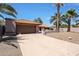 Attractive single-Gathering house featuring a large driveway, desert landscaping, and a charming terracotta tile roof at 4854 E Blanche Dr, Scottsdale, AZ 85254