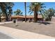 Beautiful single-story home with well-maintained desert landscaping and mature trees, creating an inviting curb appeal at 4854 E Blanche Dr, Scottsdale, AZ 85254