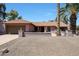 Charming single-story home with tile roof, desert landscaping, and a welcoming fountain in the front yard at 4854 E Blanche Dr, Scottsdale, AZ 85254
