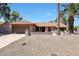 Lovely single-story home featuring a terra cotta roof, desert landscaping, and a charming front yard fountain at 4854 E Blanche Dr, Scottsdale, AZ 85254