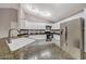Kitchen boasts granite counters, stainless steel appliances, and white cabinetry at 4854 E Blanche Dr, Scottsdale, AZ 85254