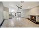 Open-concept living room has tile floors, fireplace, and connects to the kitchen at 4854 E Blanche Dr, Scottsdale, AZ 85254