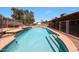Backyard pool area fenced in, ready for relaxation and entertainment with a basketball hoop at 4854 E Blanche Dr, Scottsdale, AZ 85254