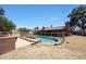Backyard pool with safety fence and fire pit, perfect for year-round enjoyment and entertaining guests at 4854 E Blanche Dr, Scottsdale, AZ 85254