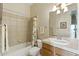 Bathroom with shower-tub combo and vanity with decorative lighting at 5370 S Desert Dawn Dr # 56, Gold Canyon, AZ 85118