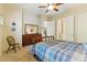 Spacious bedroom with a ceiling fan, dresser, and access to the en suite bathroom, offering comfort and convenience at 5370 S Desert Dawn Dr # 56, Gold Canyon, AZ 85118