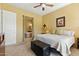 Comfortable bedroom with a glimpse into an en-suite bathroom showcasing a luxurious soaking tub at 5370 S Desert Dawn Dr # 56, Gold Canyon, AZ 85118